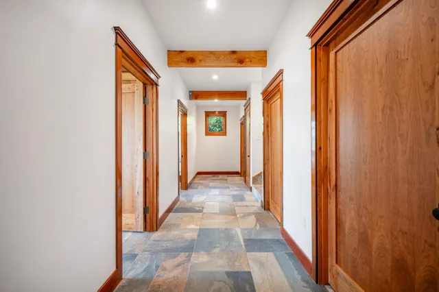 a bedroom with a bed a window and walk in closet