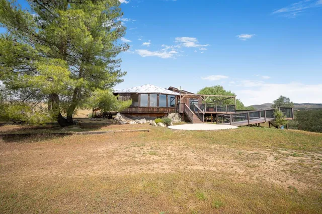 a living room with a large window and table