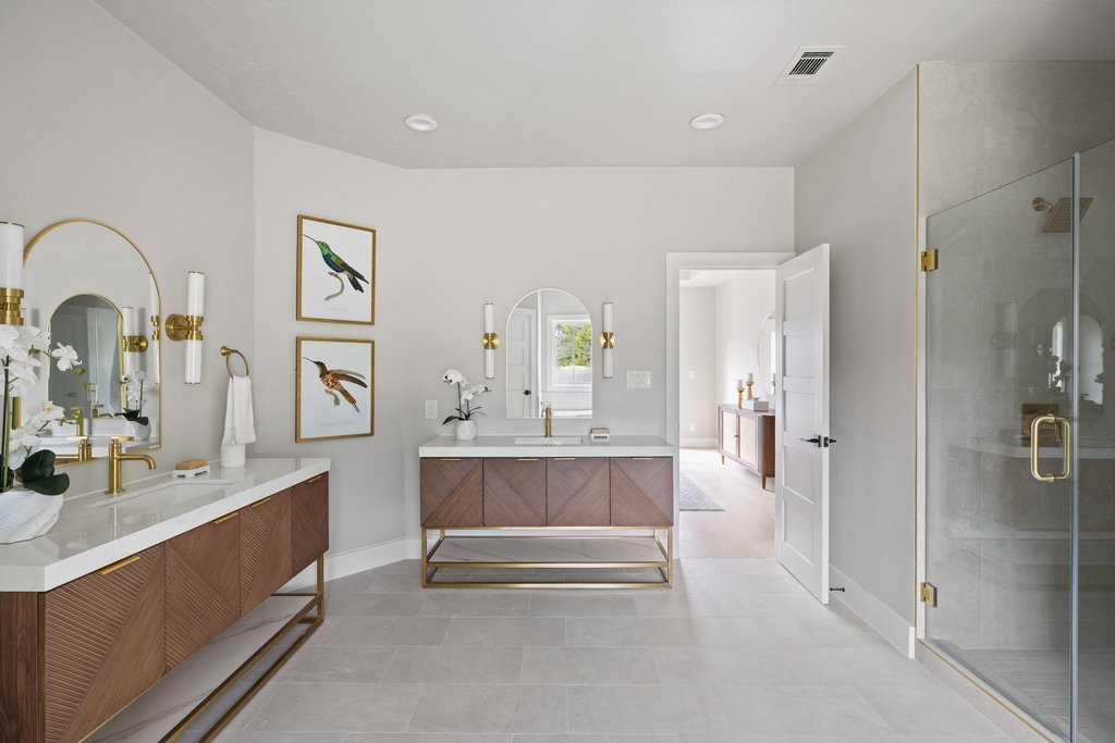 6311 Rusty Ridge Drive Austin, TX 78731 - Photo 19 of 37 a spacious bathroom with a double vanity sink a mirror and a shower
