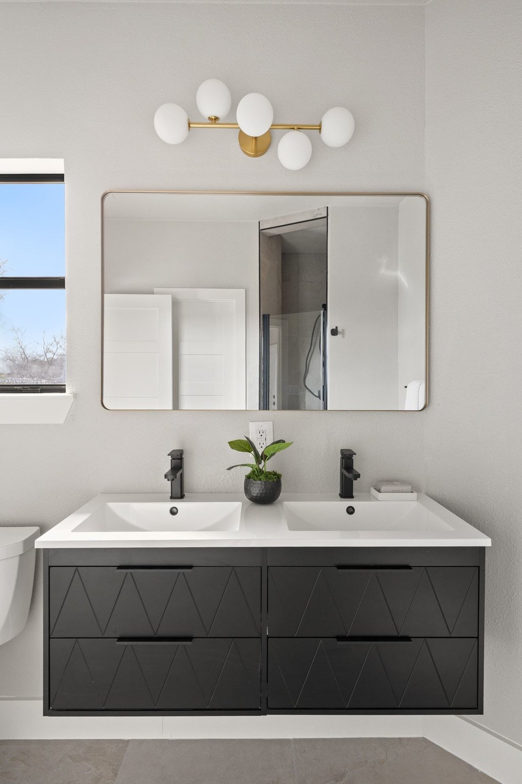6311 Rusty Ridge Drive Austin, TX 78731 - Photo 26 of 37 a bathroom with a sink and a mirror