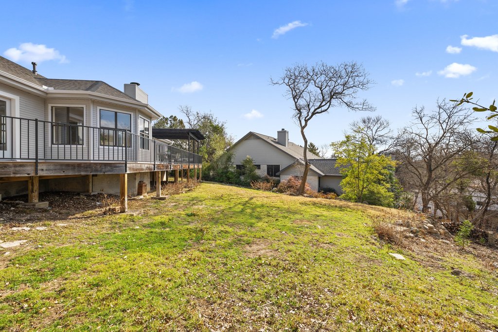 6311 Rusty Ridge Drive Austin, TX 78731 - Photo 34 of 37 a view of a house with a yard