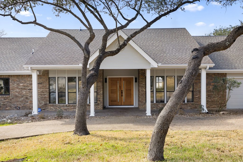 6311 Rusty Ridge Drive Austin, TX 78731 - Photo 37 of 37 a front view of a house with entertaining space