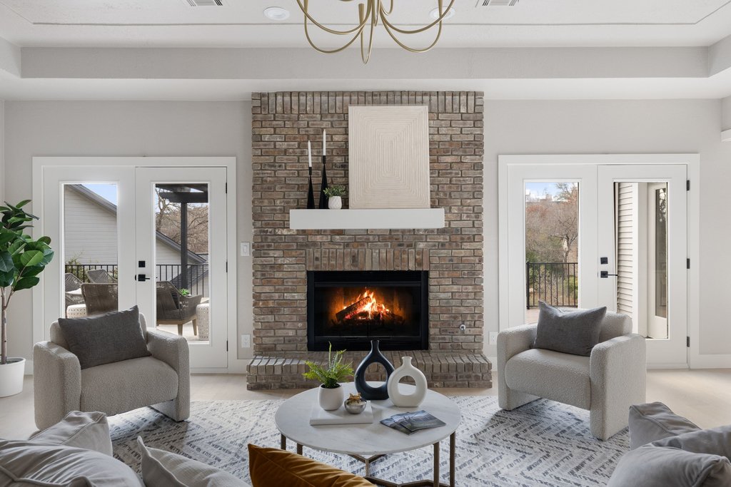 6311 Rusty Ridge Drive Austin, TX 78731 - Photo 5 of 37 a living room with furniture and a fireplace