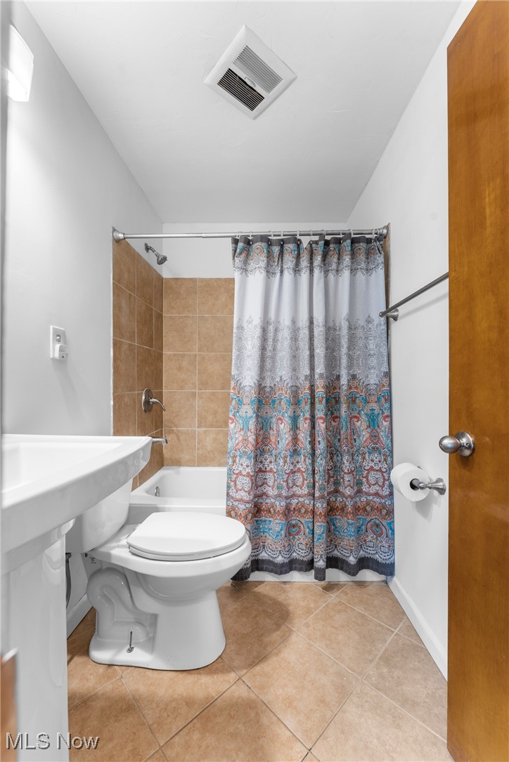 1515 Deville Avenue Northwest Canton, OH 44708 - Photo 12 of 42 Bathroom featuring shower / tub combo and tile patterned floors