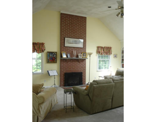 8 Redcoat Road Bedford, MA 01730 - Photo 8 of 12 a living room with furniture and a fireplace
