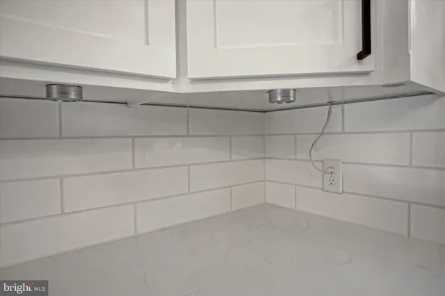 a bathroom with a sink and a washer dryer