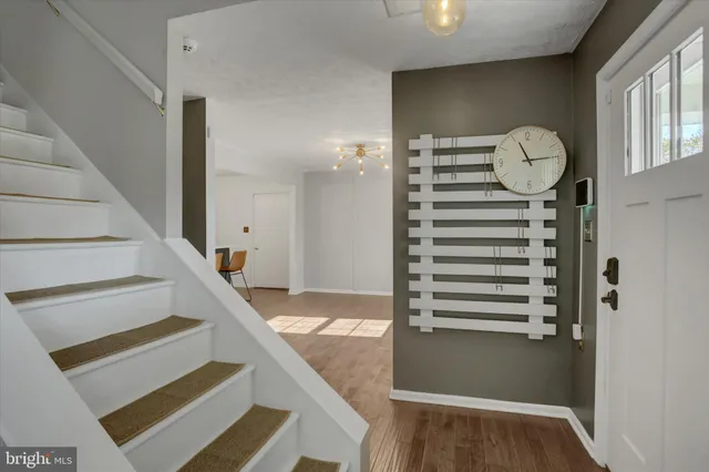 a view of entryway with wooden floor