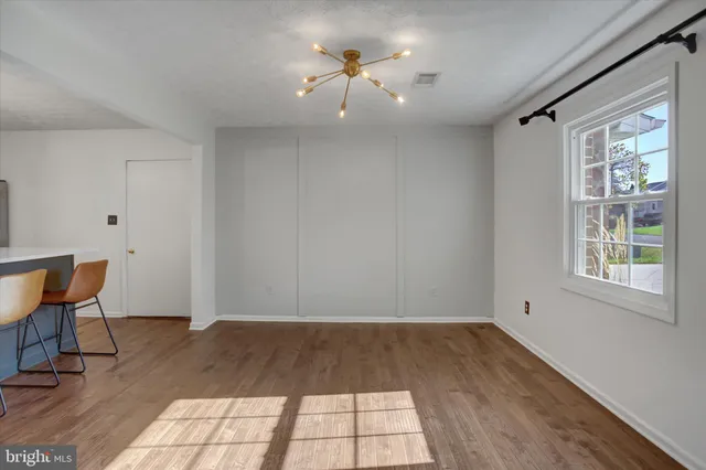 a view of workspace with wooden floor and window