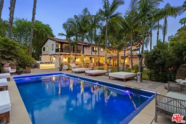a view of a swimming pool with a patio