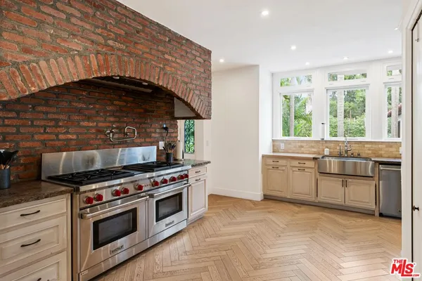 a bedroom with furniture and a flat screen tv