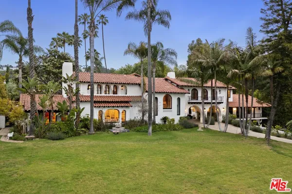 a view of a lake with a house in the background