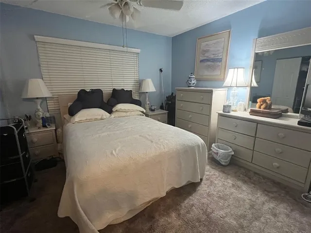 a bedroom with a bed and a closet