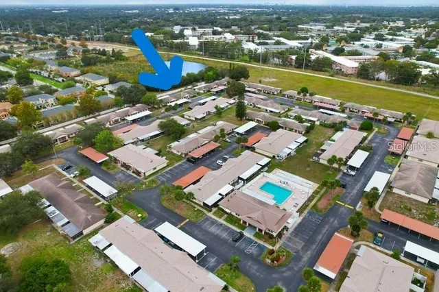 an aerial view of a city with lake view