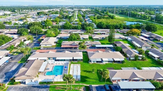an aerial view of multiple houses with yard
