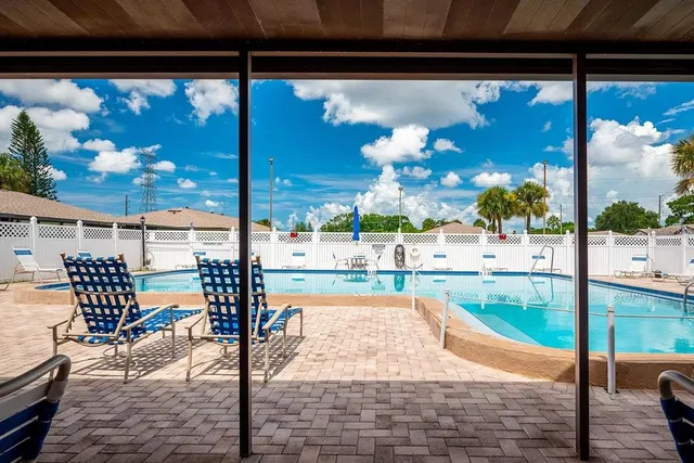 a view of swimming pool with patio