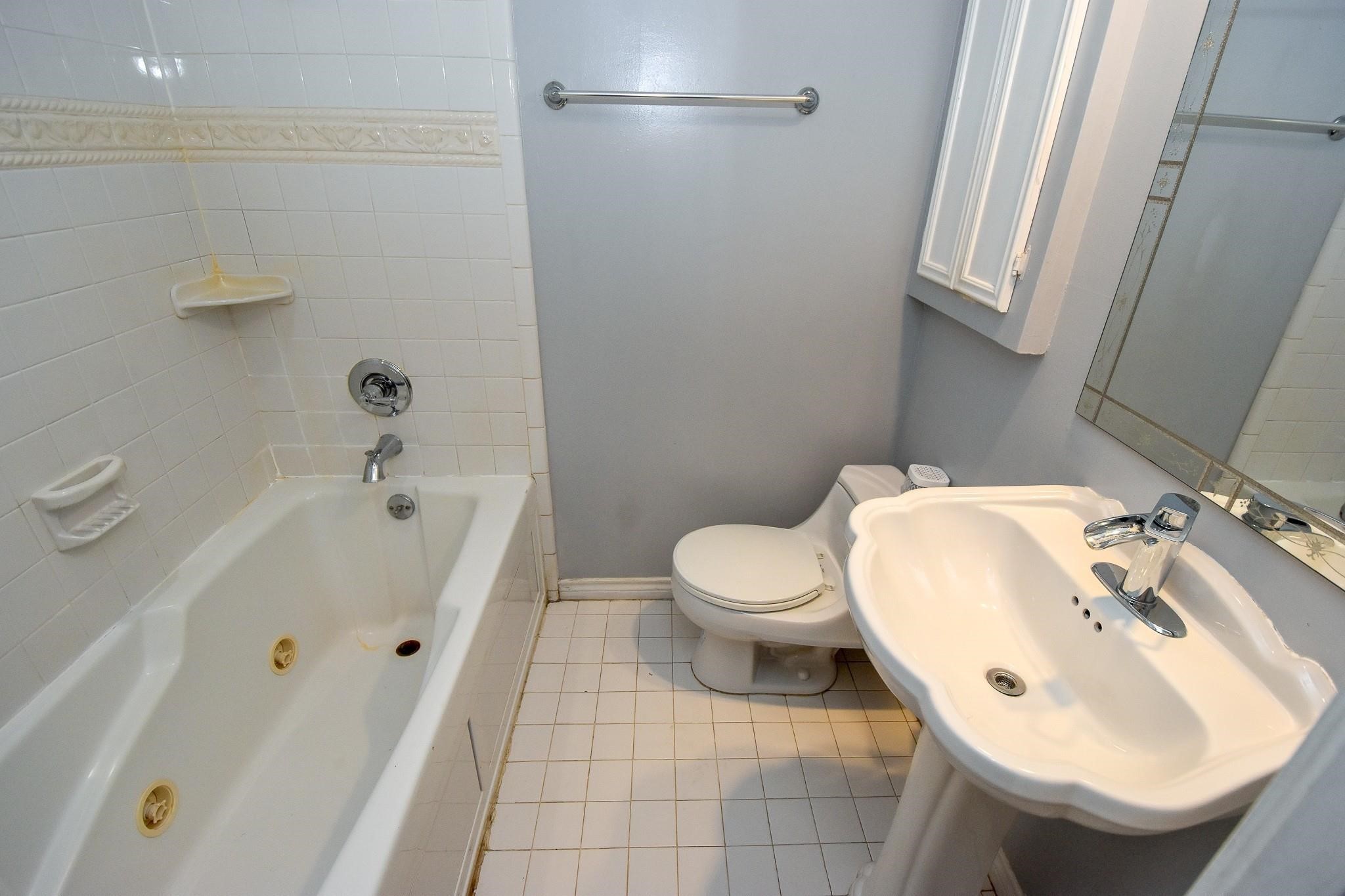 3400 Timmons Lane, Unit 78 Houston, TX 77027 - Photo 17 of 20 a bathroom with a sink and a toilet