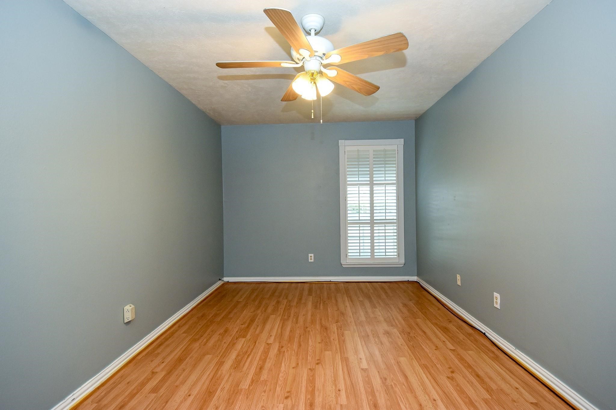 3400 Timmons Lane, Unit 78 Houston, TX 77027 - Photo 8 of 20 wooden floor in an empty room with a window