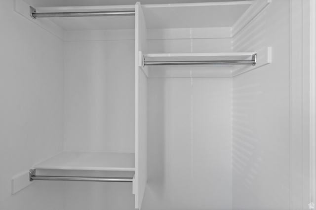 1264 West 500 South, Unit 320 Logan, UT 84321 - Photo 35 of 39 Built-in closet system featuring white shelving and chrome hanging rods