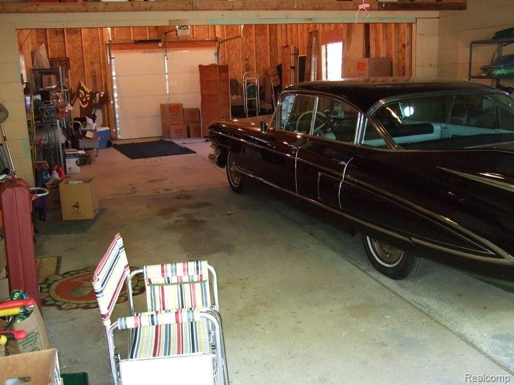 1,012 SQUARE FOOT FOUR CAR GARAGE...CADDY NOT INCLUDED. HAS FRONT AND REAR ENTRY DOORS.