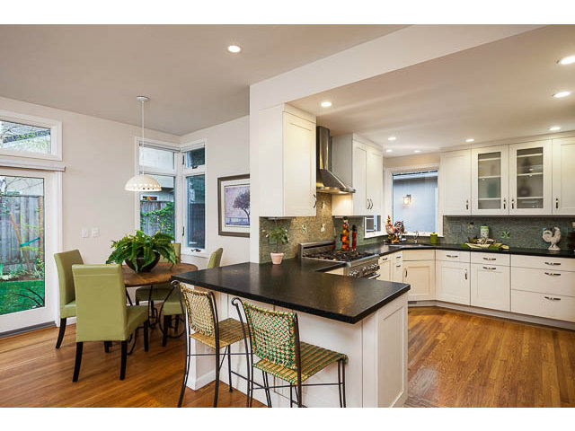 145 Cornell Road Menlo Park, CA 94025 - Photo 3 of 14 a kitchen with granite countertop a table chairs stove and cabinets