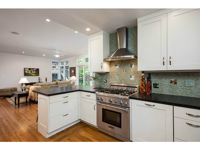 145 Cornell Road Menlo Park, CA 94025 - Photo 4 of 14 a kitchen with stainless steel appliances granite countertop a stove and white cabinets