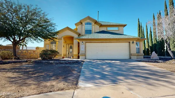 a front view of a house with yard