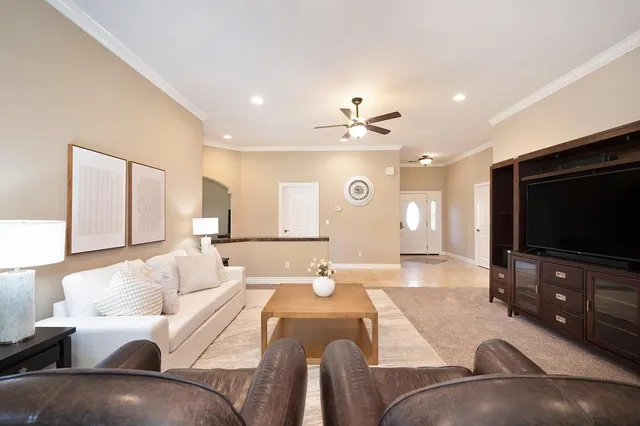 a view of a livingroom with furniture window and wooden floor