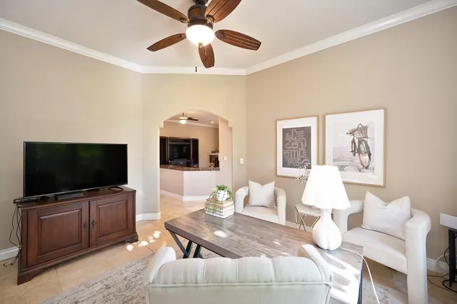 a dining room with furniture window and outside view