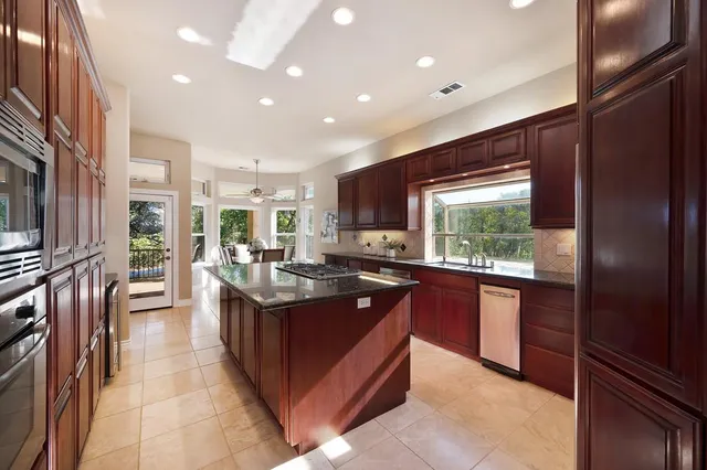 a view of a dining room with furniture window and outside view