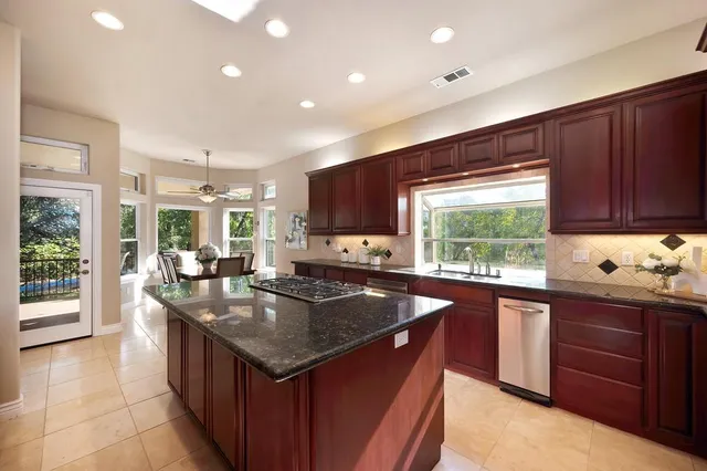 a view of an empty room with closet and gallery