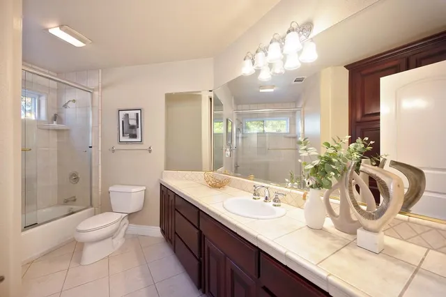 a view of a porch with wooden floor and iron stairs