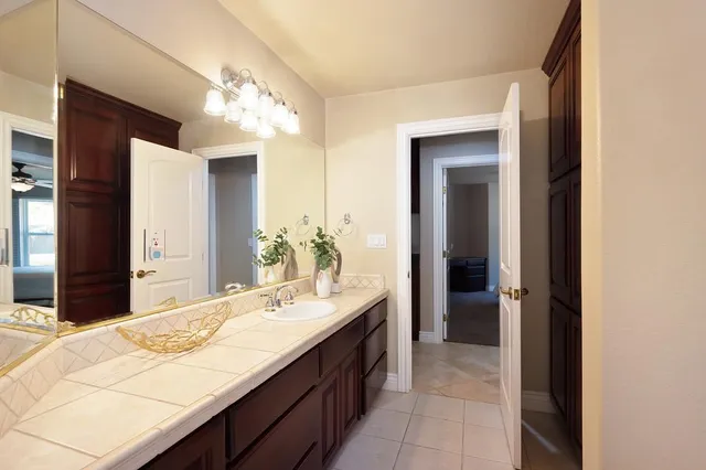 a view of a table and chairs under an umbrella