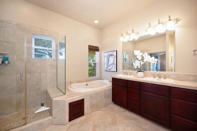 a view of a chairs and table in backyard of the house