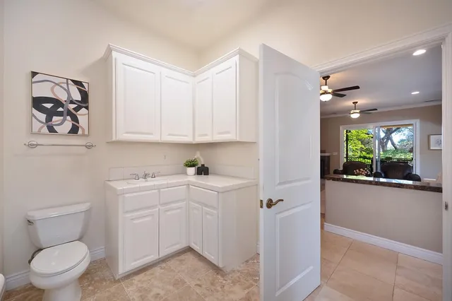 an aerial view of house with yard and mountain view in back