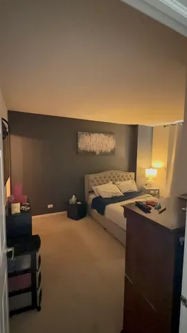 a bedroom with a bed and furniture