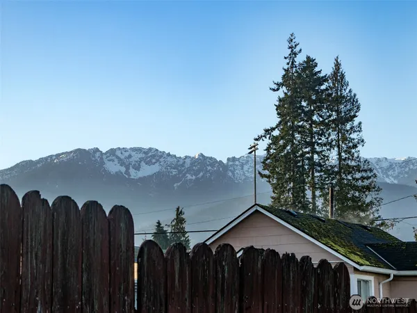 a view of a house with a backyard space