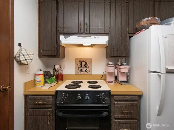 a kitchen with a appliances and cabinets