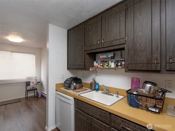 a kitchen with a sink and cabinets