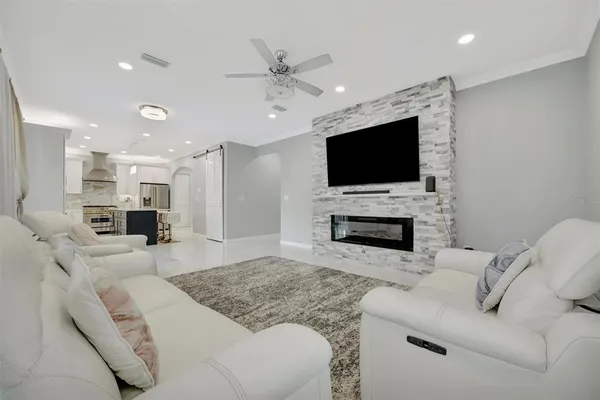 a bathroom with a granite countertop sink a toilet and shower