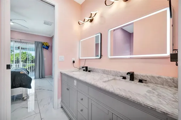 a view of walk in closet with clothes