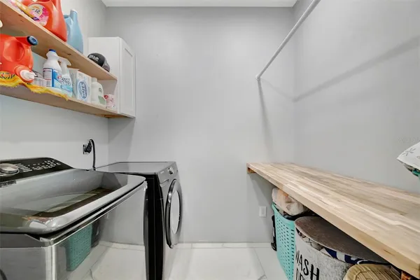 a view of a patio with couches and potted plants