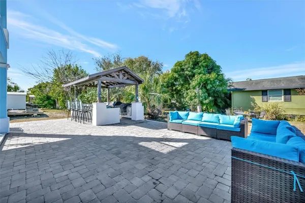 a view of a chairs and table in the patio