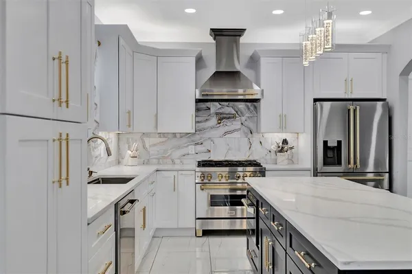 a stove top oven sitting inside of a kitchen