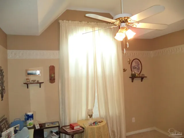 a bathroom with a granite countertop sink a mirror and shower
