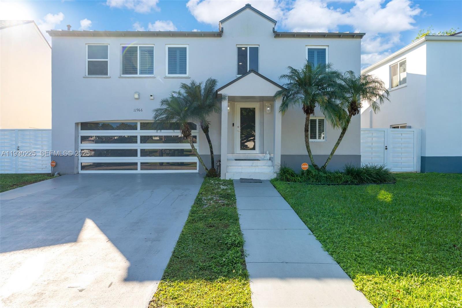 11966 Southwest 271st Street Homestead, FL 33032 - Photo 1 of 41 a front view of a house with a yard