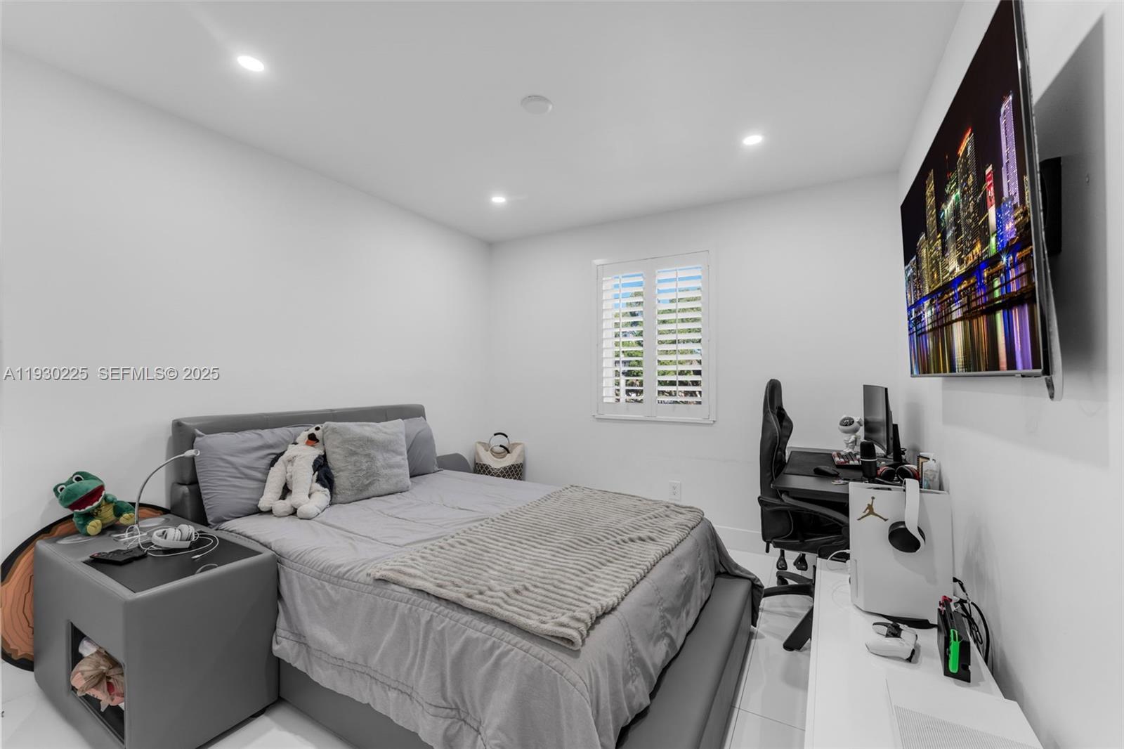 11966 Southwest 271st Street Homestead, FL 33032 - Photo 15 of 41 a bedroom with a bed and a window