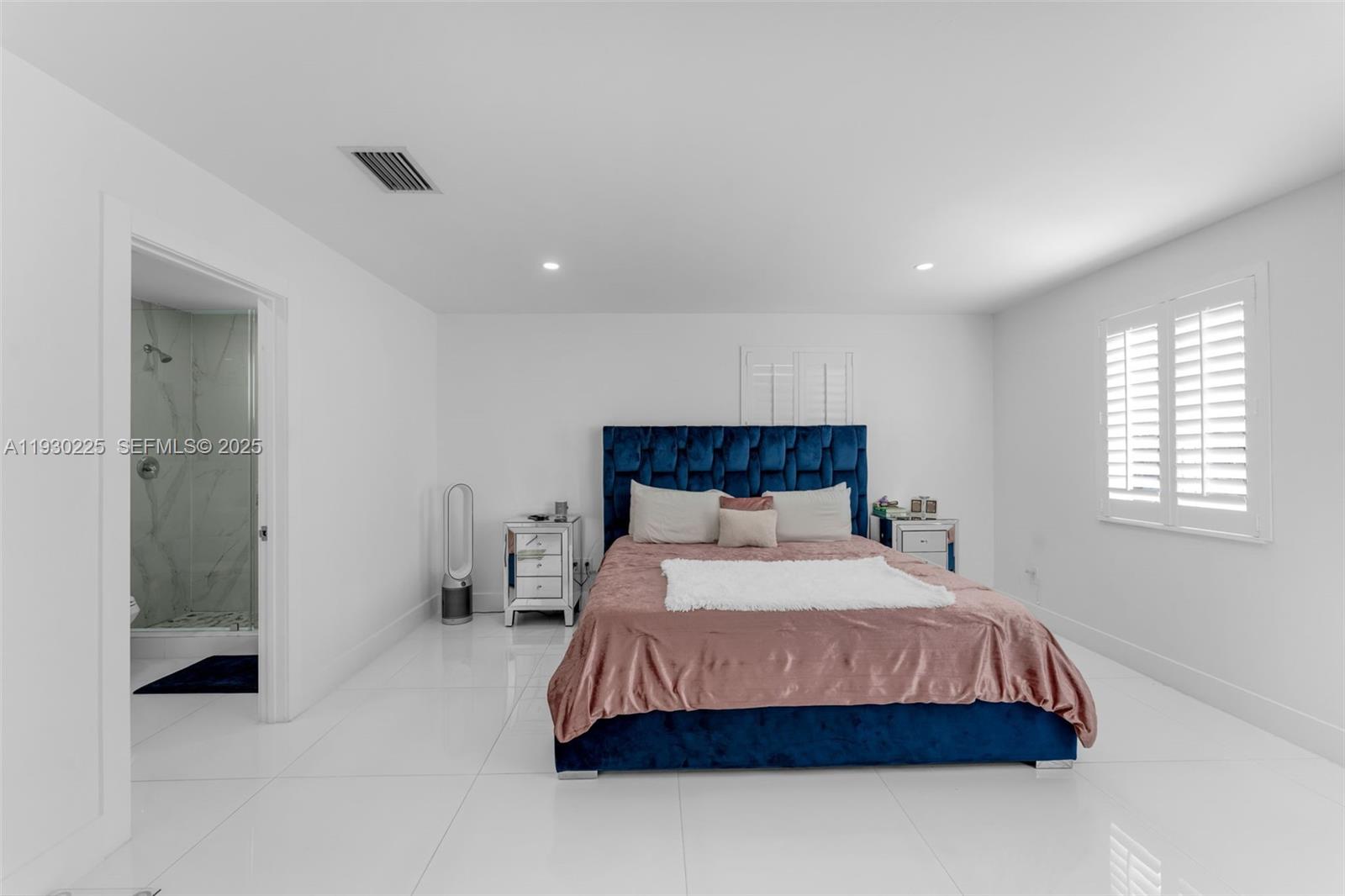 11966 Southwest 271st Street Homestead, FL 33032 - Photo 22 of 41 a bedroom with a bed and a mirror