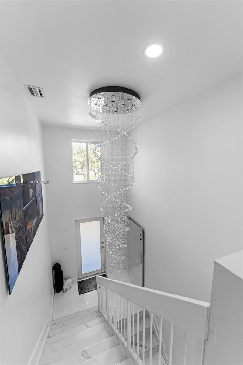 11966 Southwest 271st Street Homestead, FL 33032 - Photo 8 of 41 a view of a hallway with windows