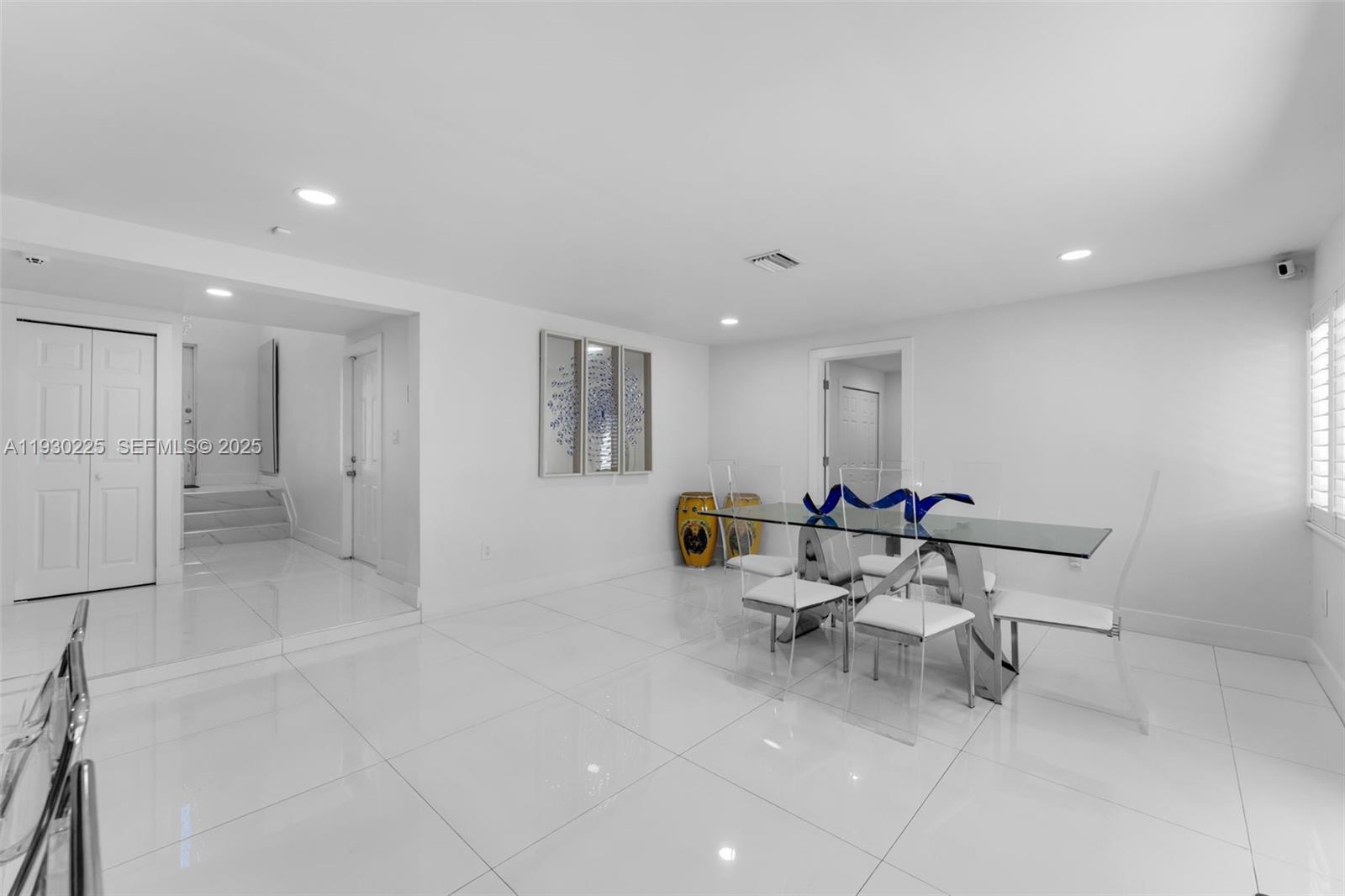 11966 Southwest 271st Street Homestead, FL 33032 - Photo 9 of 41 a view of a big room with entryway a table and chairs