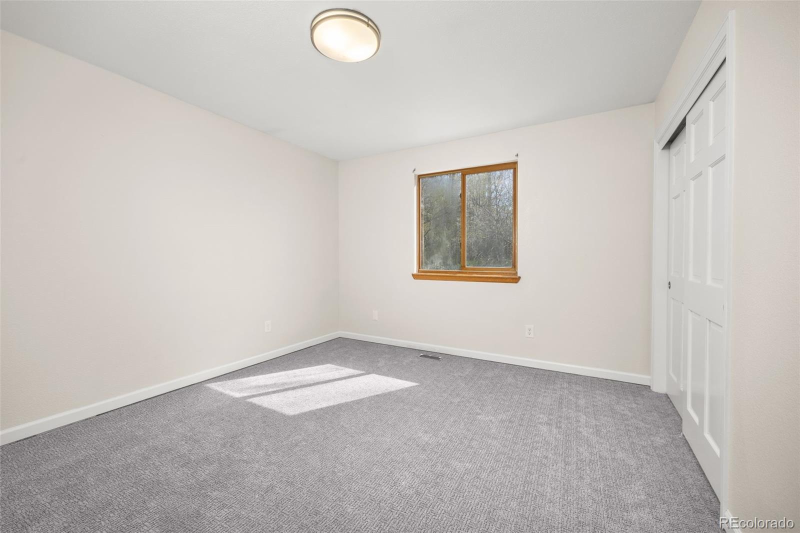 6868 Johnson Street Arvada, CO 80004 - Photo 17 of 39 an empty room with a window